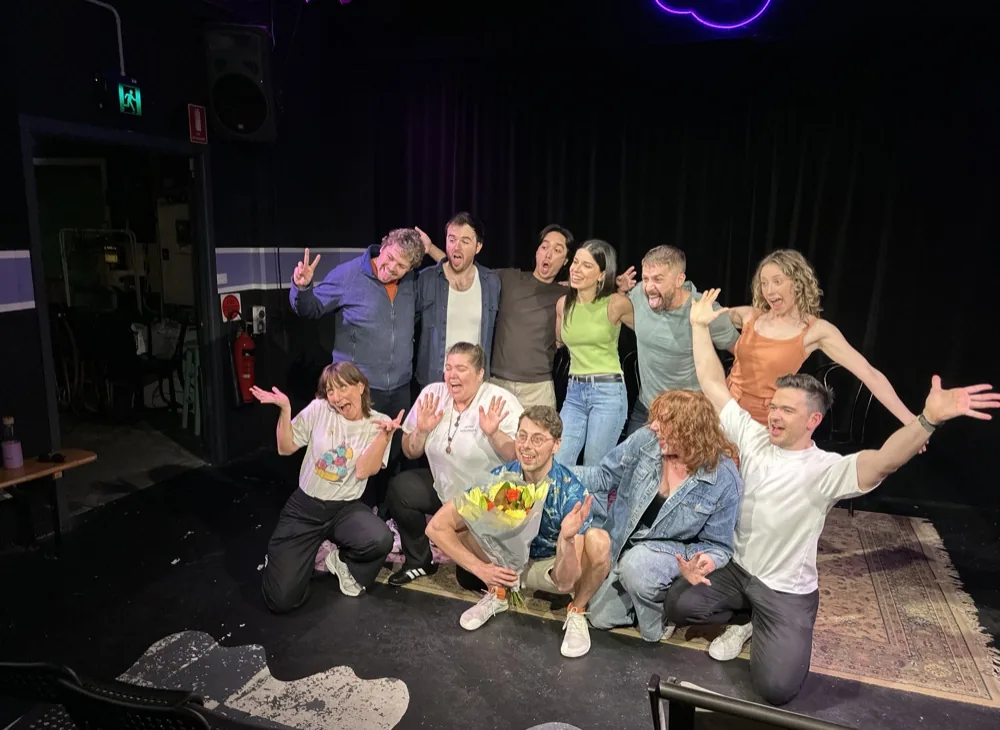 Our improv class celebrating on stage